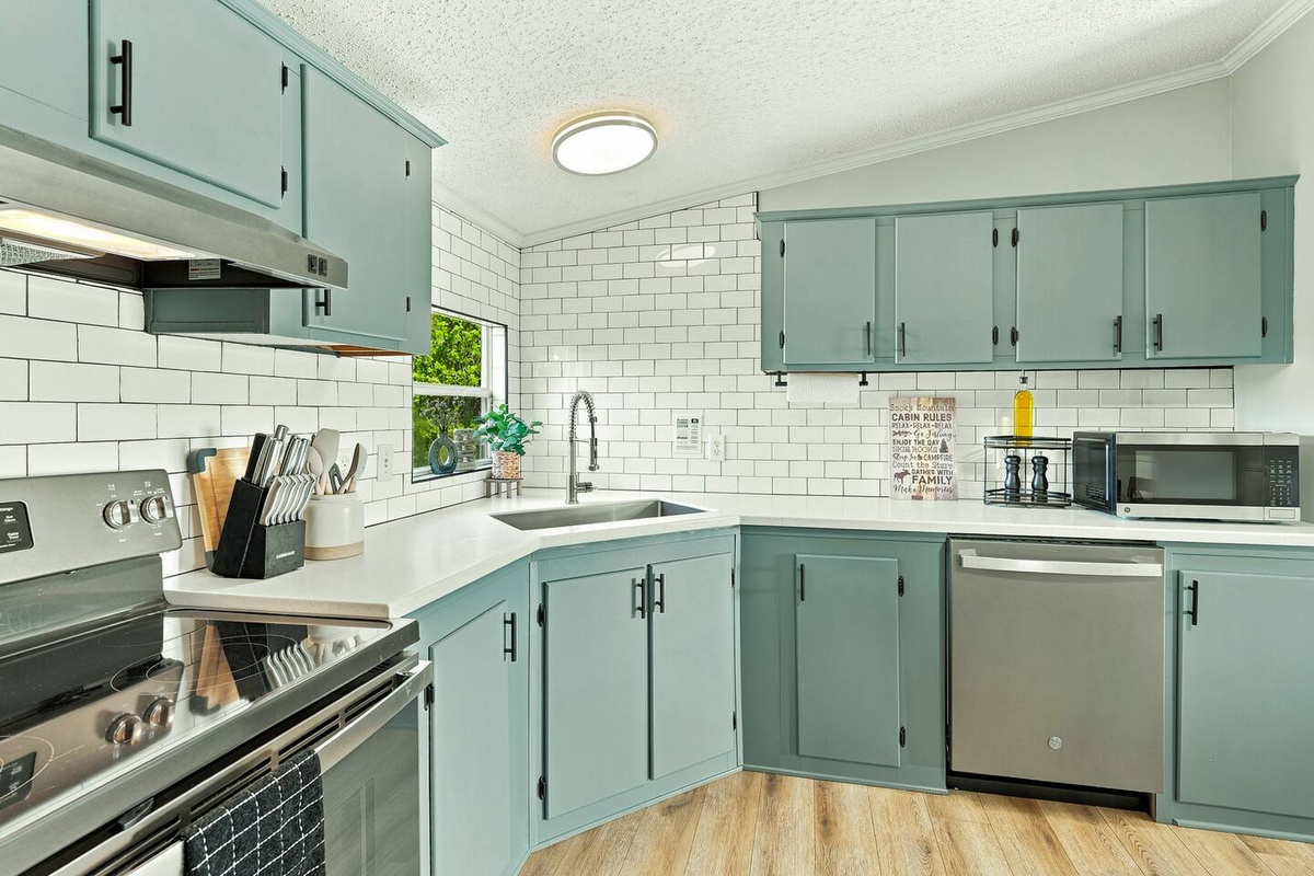 Plenty of counter space makes meal prep easy with a full-size dishwasher for quick cleanup. The kitchen is stocked with cookware, dishes, utensils, and everyday essentials, so you can comfortably cook during your stay.
