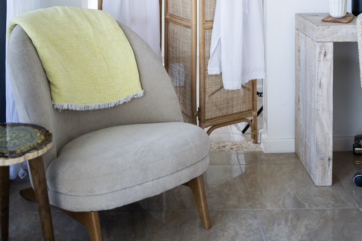 Thoughtfully designed couch with soft neutral tones for a soothing atmosphere.