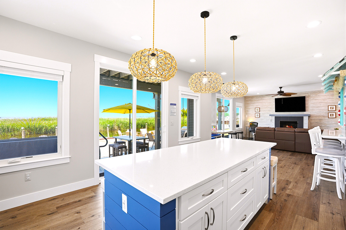 The oversized island offers plenty of prep space, seating, and room to gather—making it the perfect centerpiece for meals, snacks, and conversation.