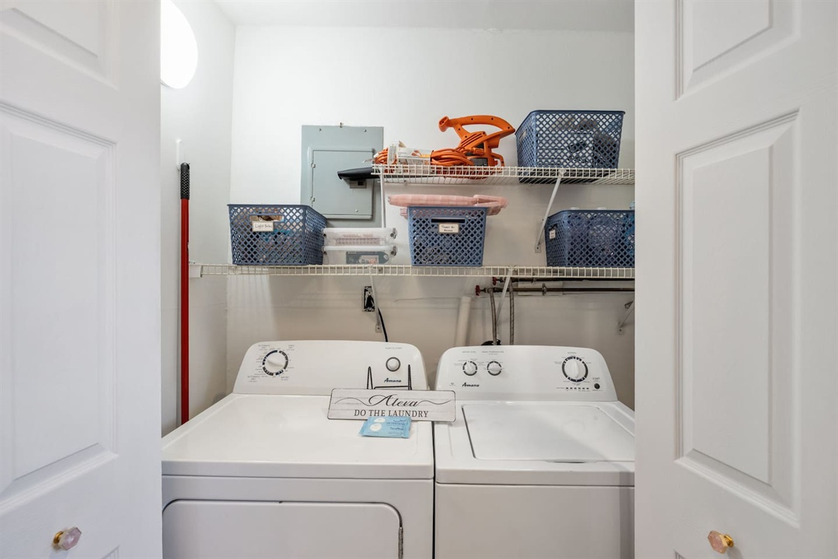 Full size washer and dryer in the kitchen area.