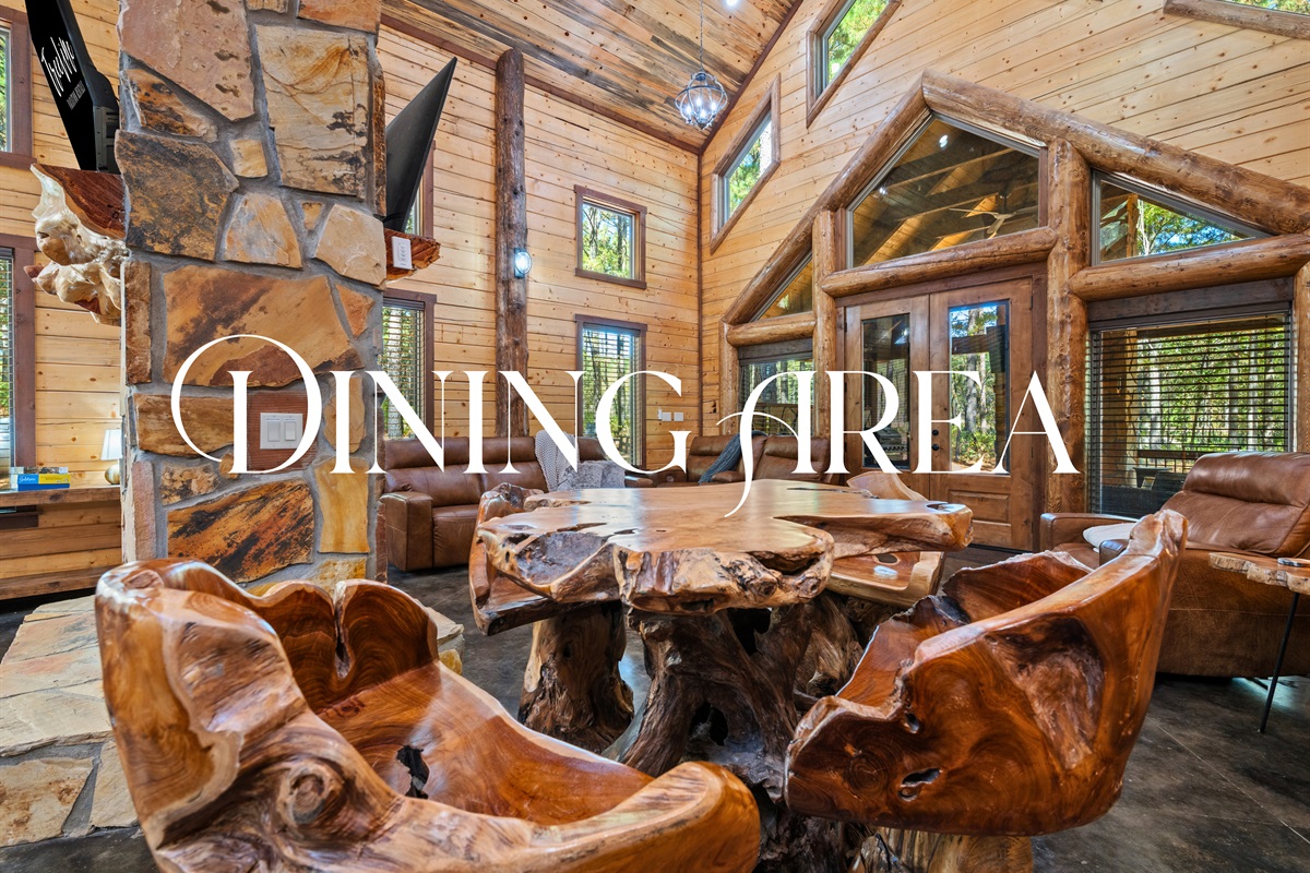 Dining area featuring a handcrafted wood table and cozy atmosphere.