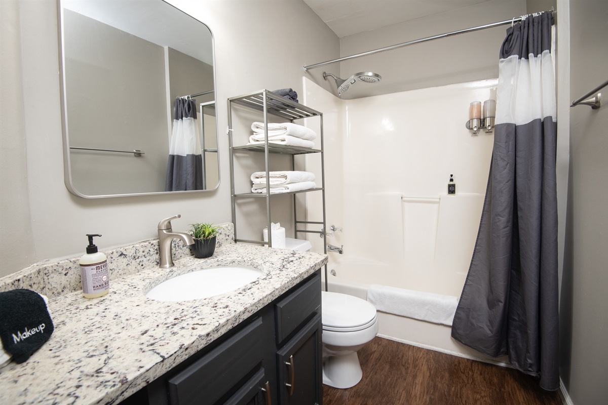 This ensuite bathroom is attached to the double queen bedroom in Unit C. Both bathrooms come complete with shampoo, body wash, conditioner, hand soap, and all the linens you need for a comfy stay.
