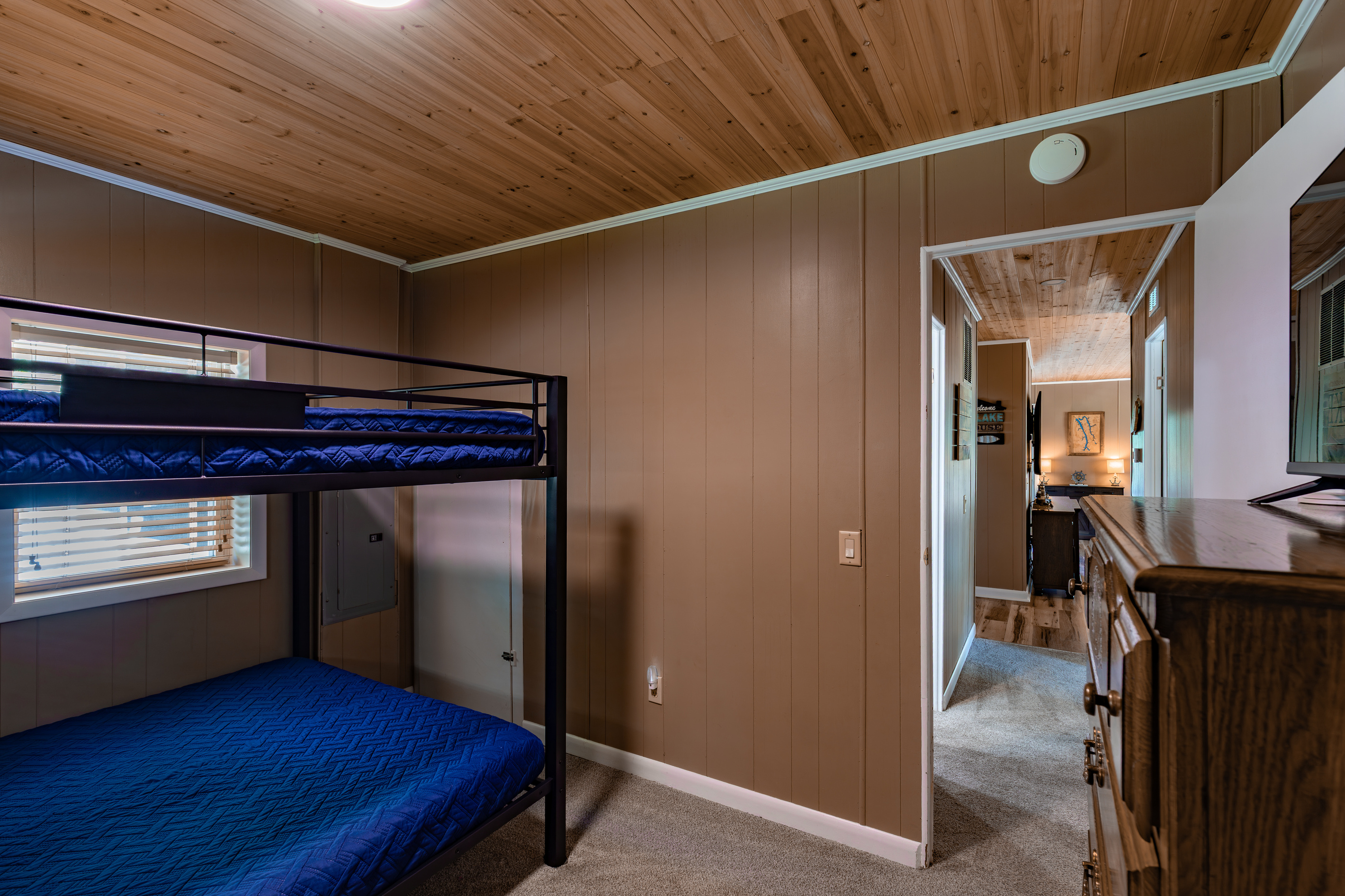 The queen-over-queen bunk room offers generous sleeping space for children, teens, or another couple traveling with the family.