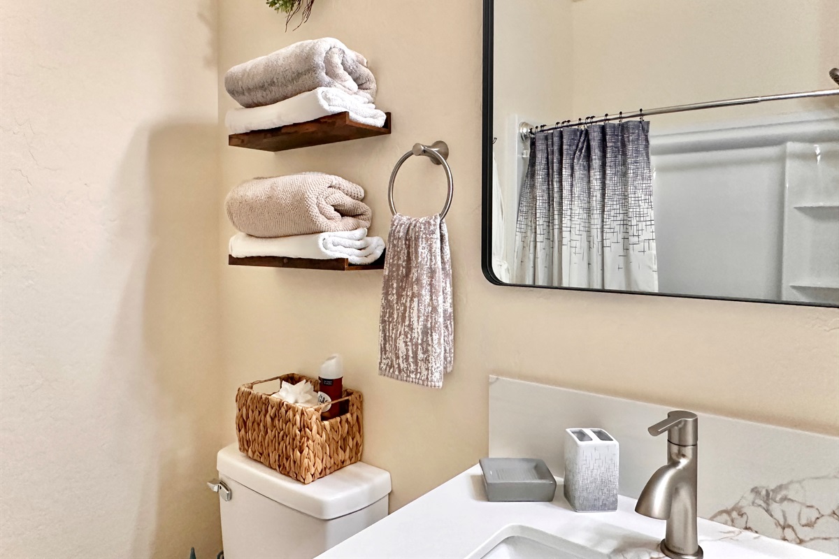 Towels and other convenient bathroom amenities provided