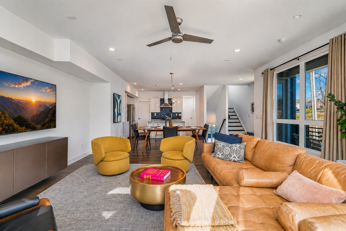 The open-concept 2nd floor main living space offers seamless movement between living room, dining, and kitchen for group hangouts. The space is comfortable and spacious.