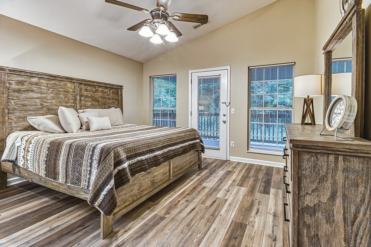 King size bedroom in the back of the house near the creek