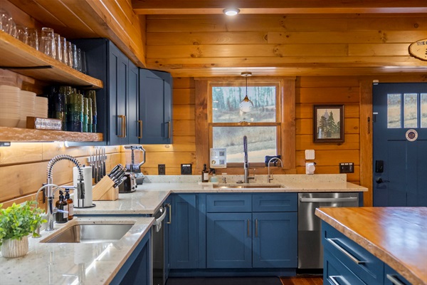 Large group kitchen designed for big family dinners. Two sinks and two dishwashers keep cleanup fast.