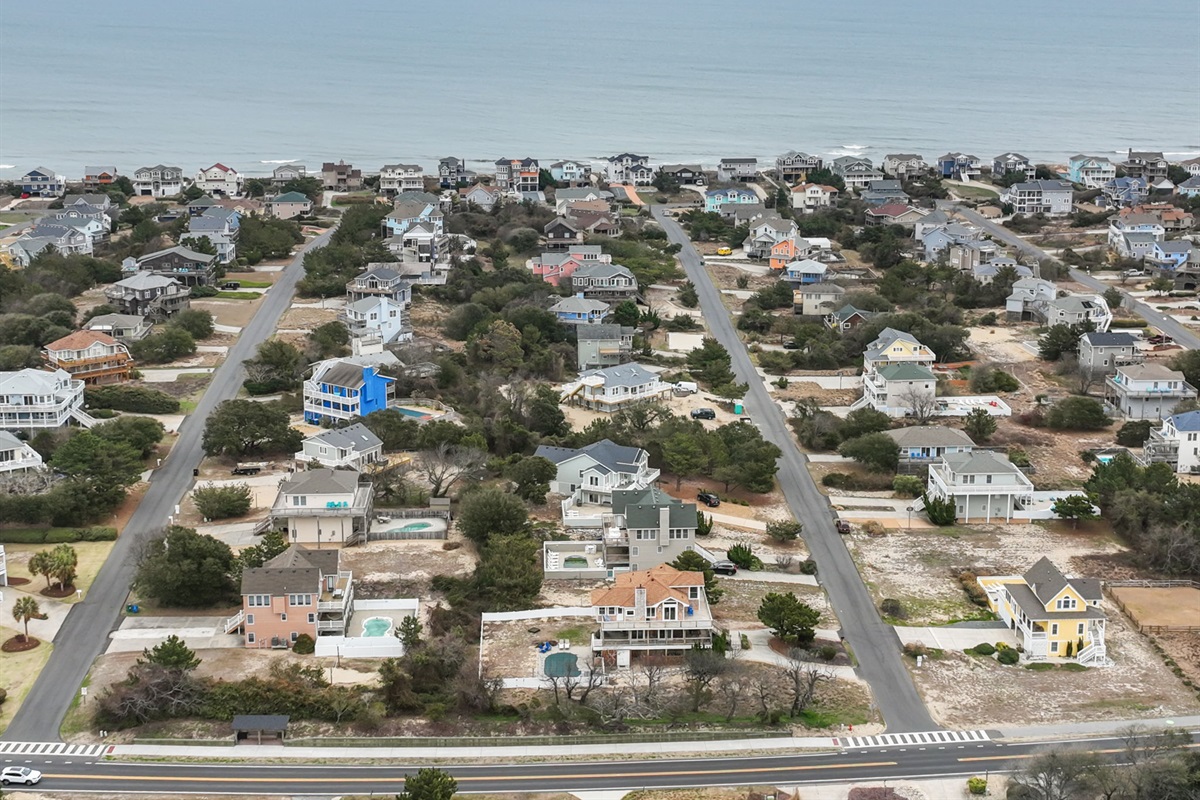 Aerial view of the peaceful coastal neighborhood, showcasing its prime location near the water and quiet streets.