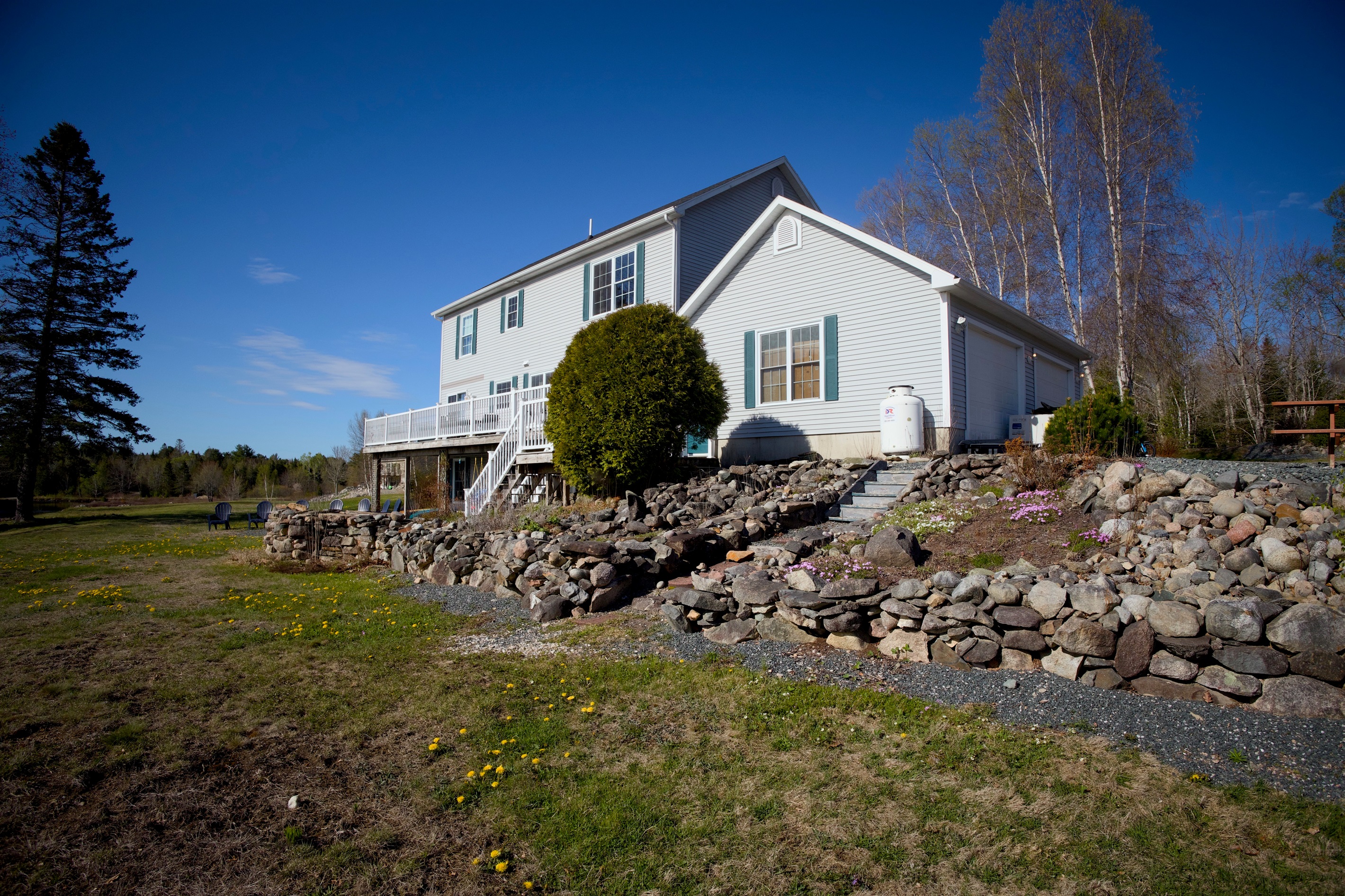Rugged, quintessential Maine. River rock stacked in all the places.