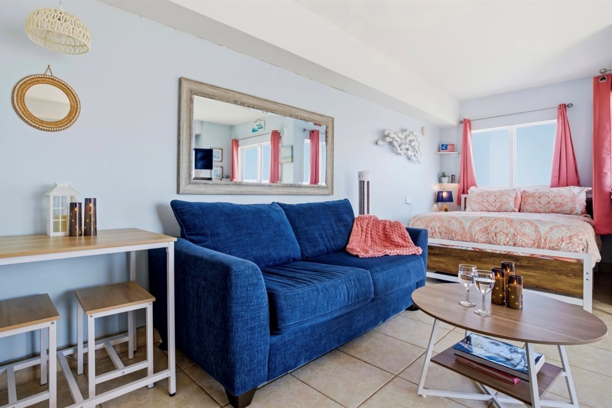 A calm, welcoming living space styled with soft coastal tones and natural light. Simple, elevated, and intentionally designed for rest, comfort, and connection. ⭐