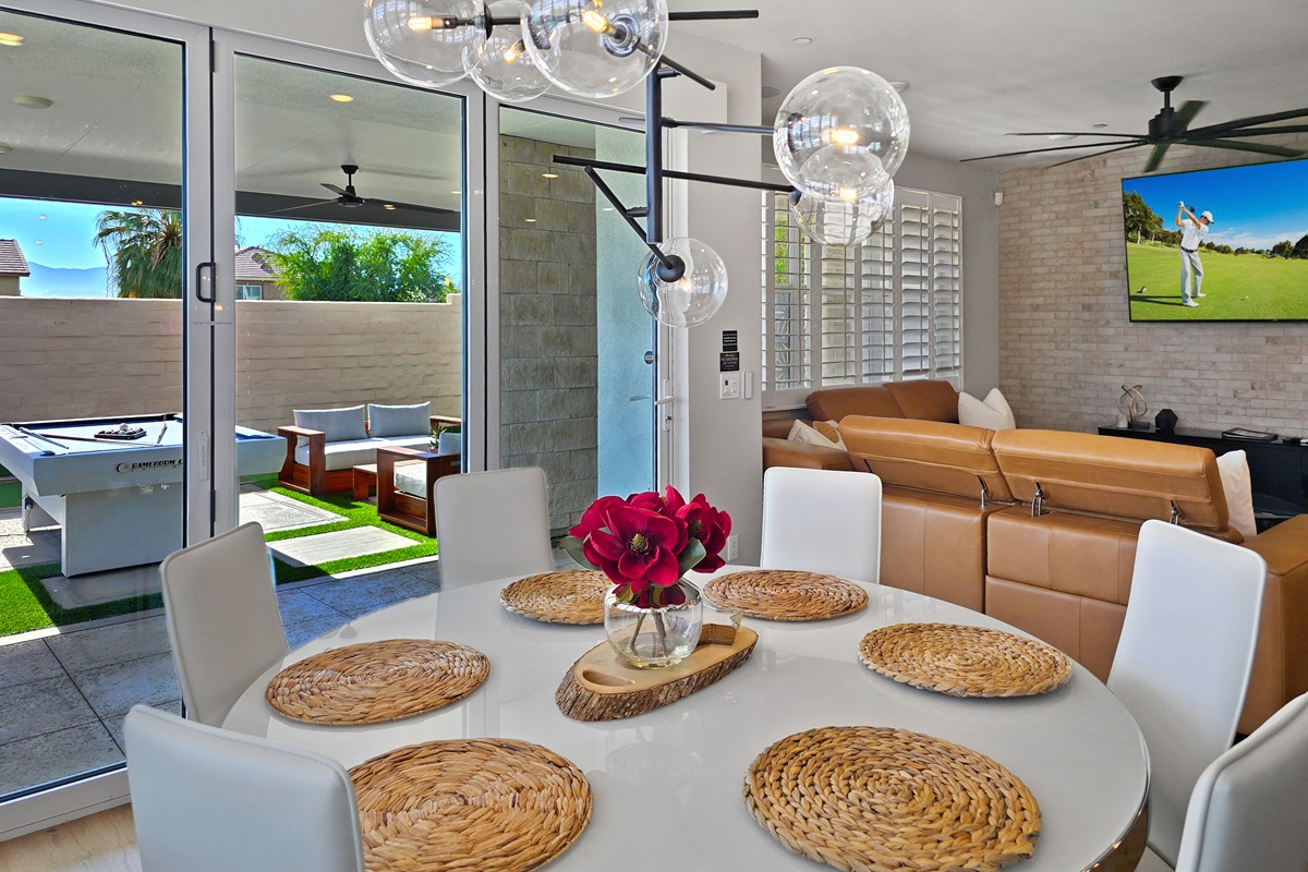 The dining room opens effortlessly to the backyard, creating a bright, sun-filled space perfect for indoor-outdoor living.