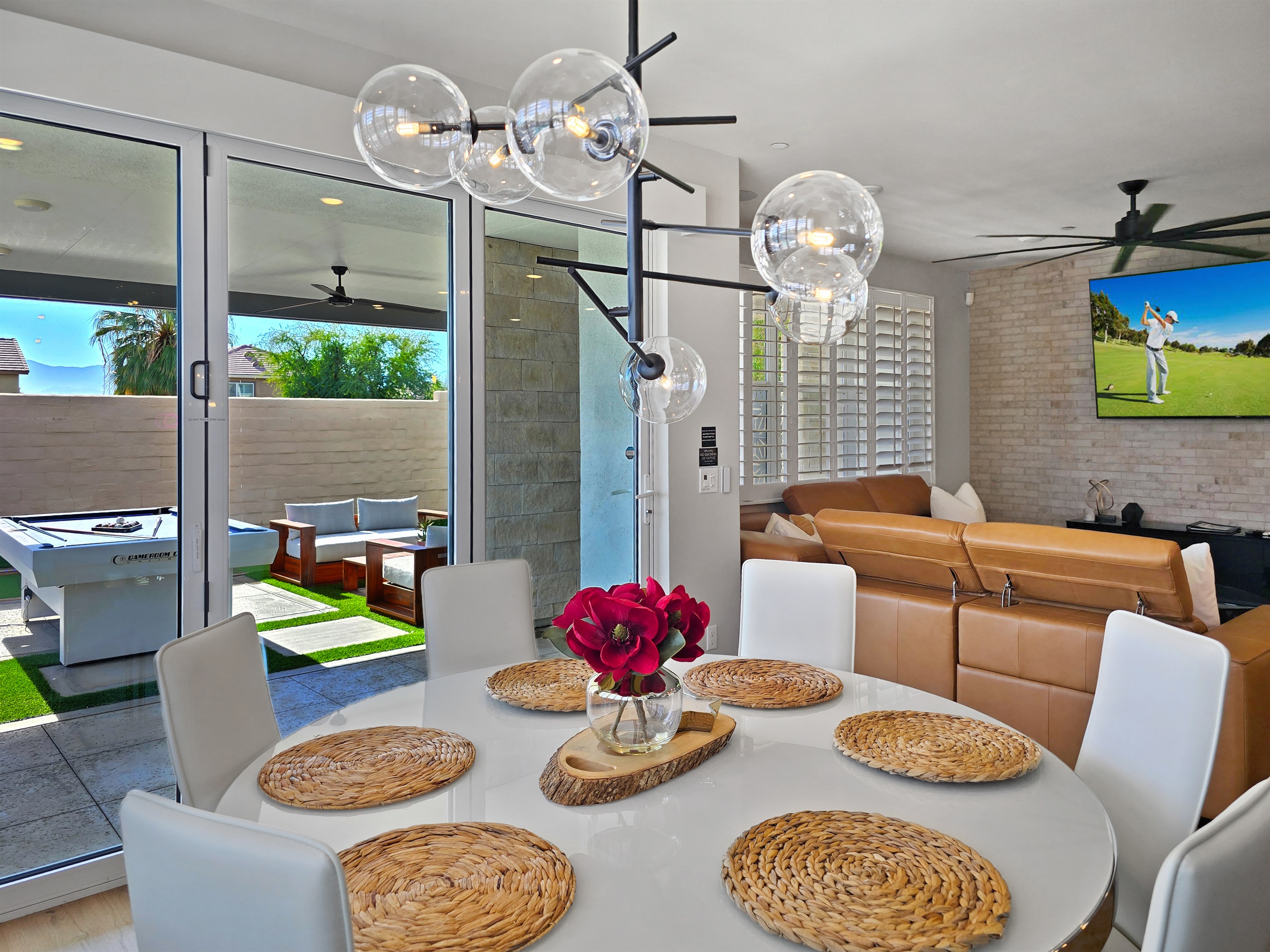 The dining room opens effortlessly to the backyard, creating a bright, sun-filled space perfect for indoor-outdoor living.