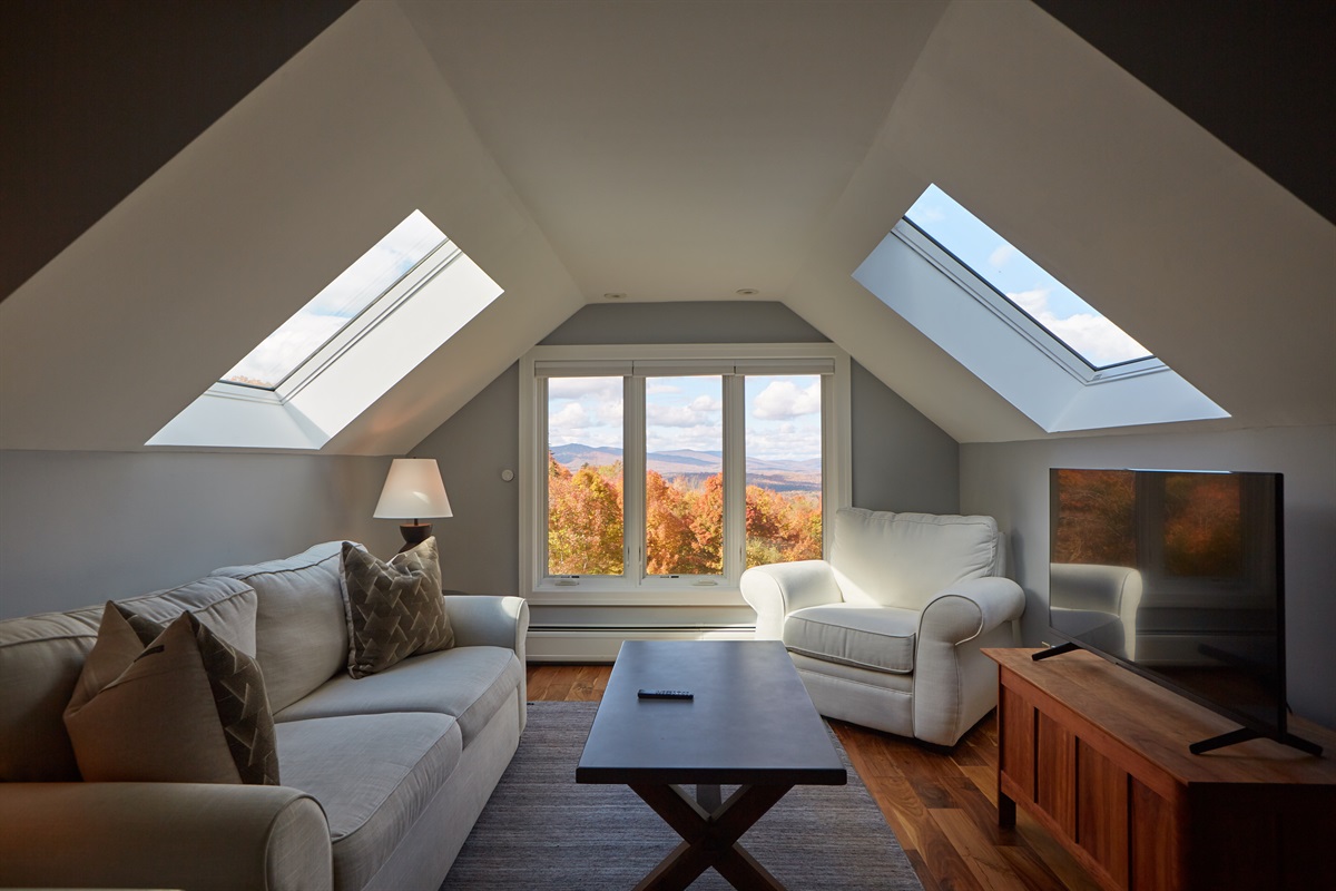 Cozy up in this inviting lounge to watch a movie or simply take in the vibrant seasonal views through the large picture windows.