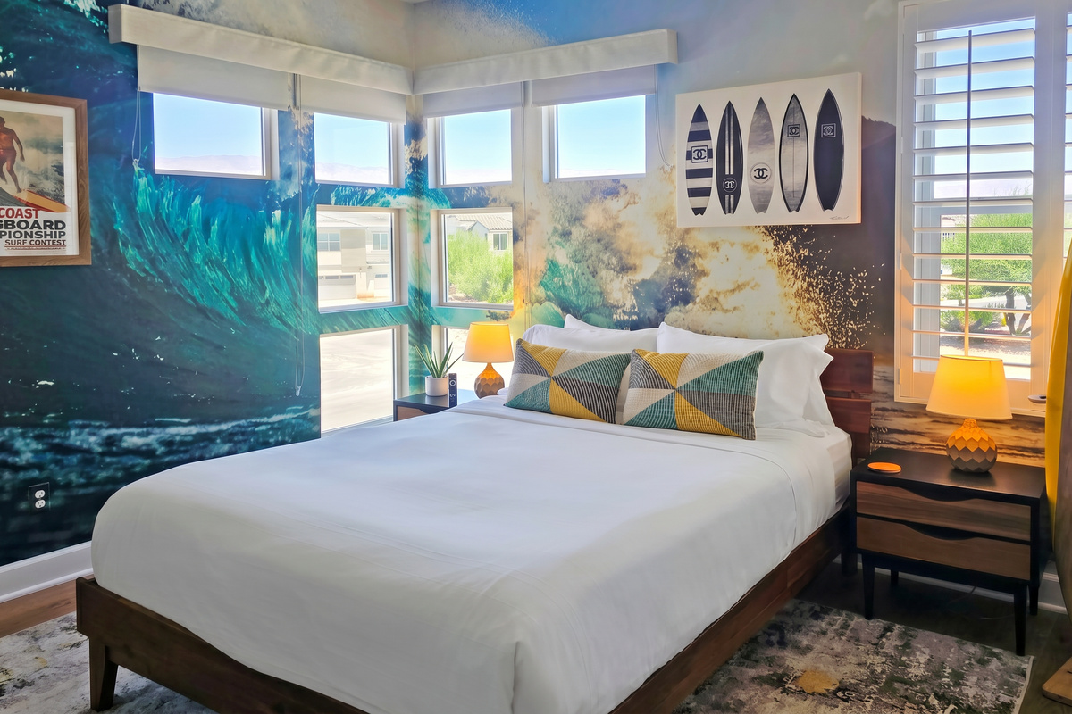 Bedroom #3 showcases tranquil lake views and an ensuite bathroom with a walk-in shower.