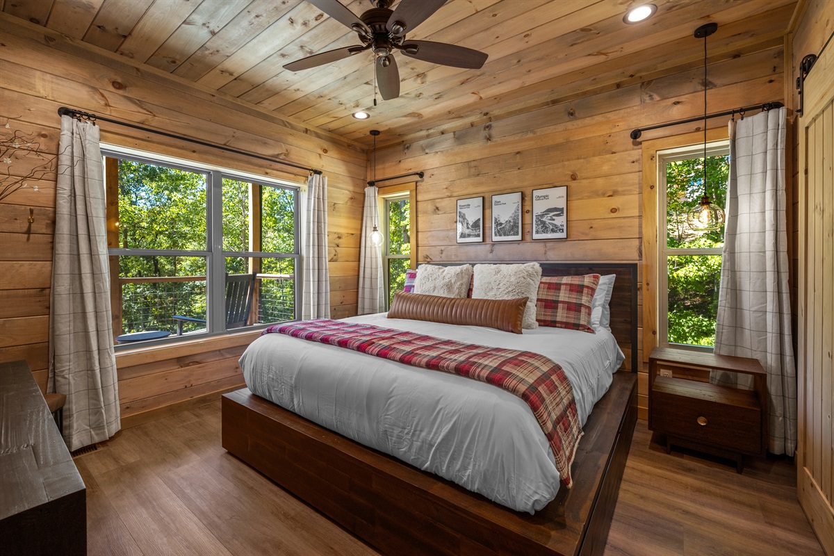 The lower level suite is surrounded by trees. 