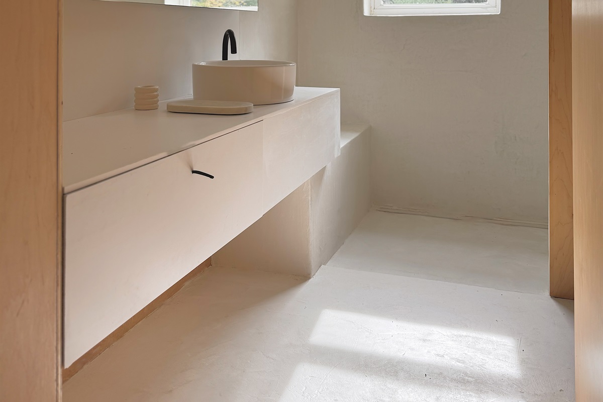 The full bathroom is located upstairs, and features an enclosed toilet room.