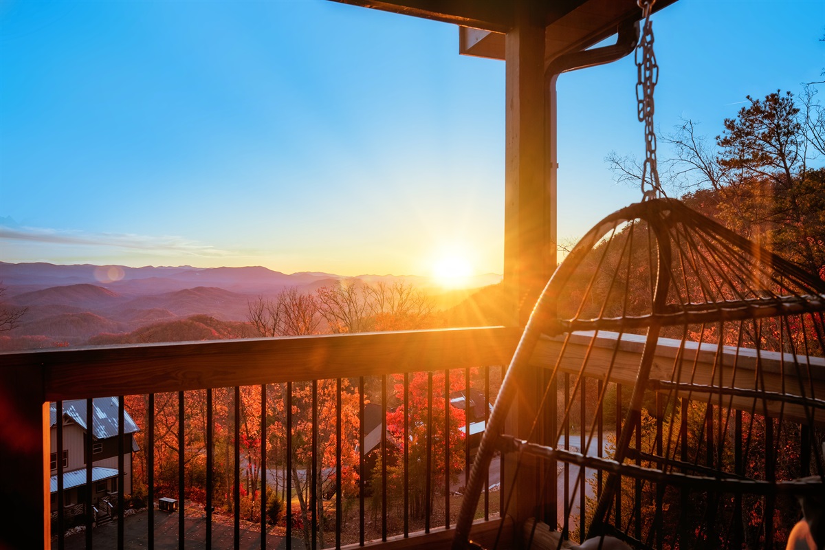 Hanging chair bliss with a stunning hilltop view. Your relaxation spot.
