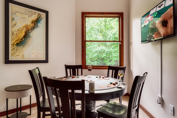 Cozy poker room with Appalachian Trail décor and streaming-ready TV.