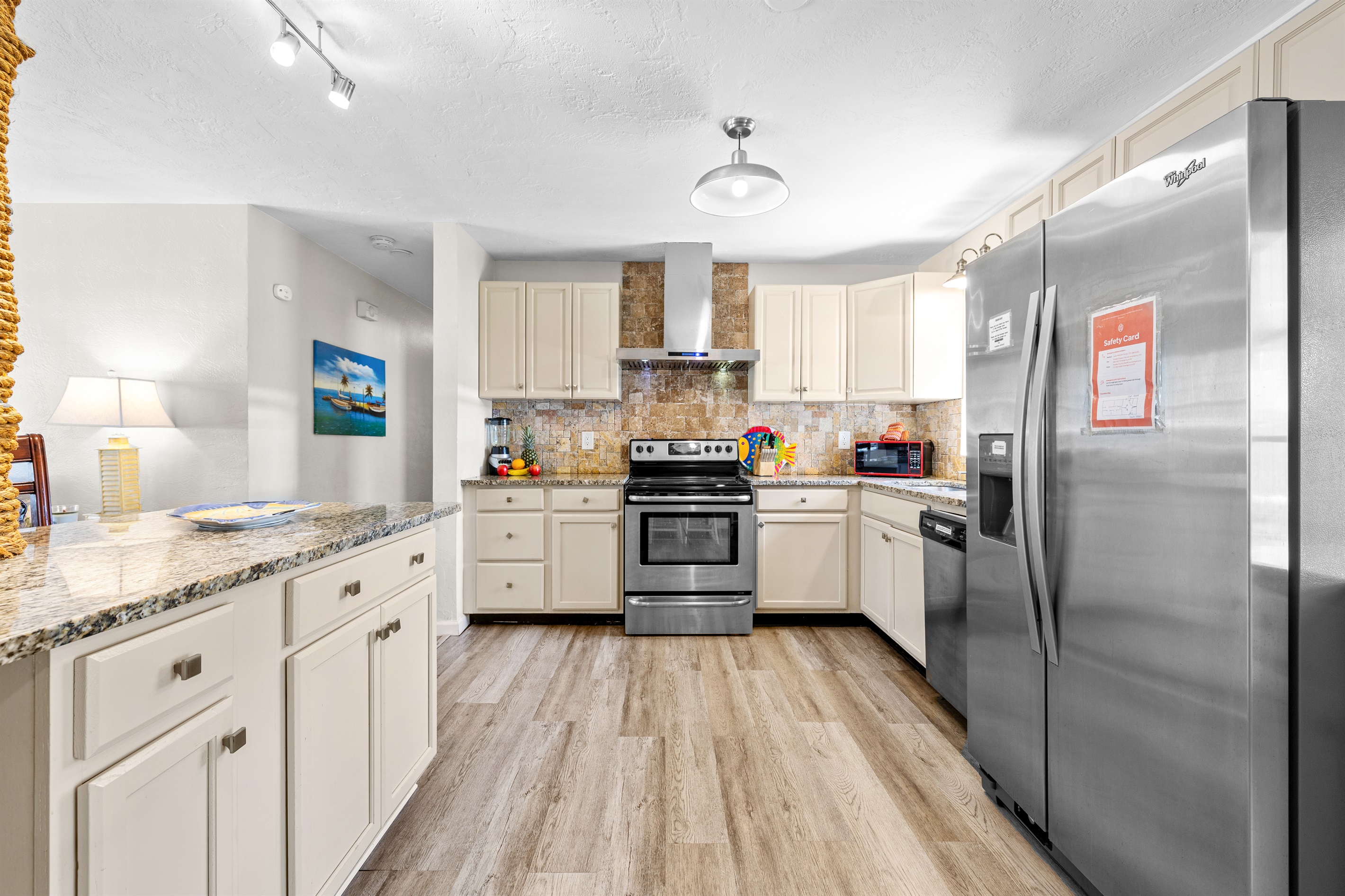 Kitchen with cookware, dishes and utensils for 10!   Kitchen includes coffee, paper towels and starter set of Dishwasher detergent.