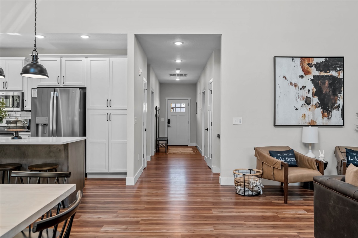 Entry hall leading into living and kitchen