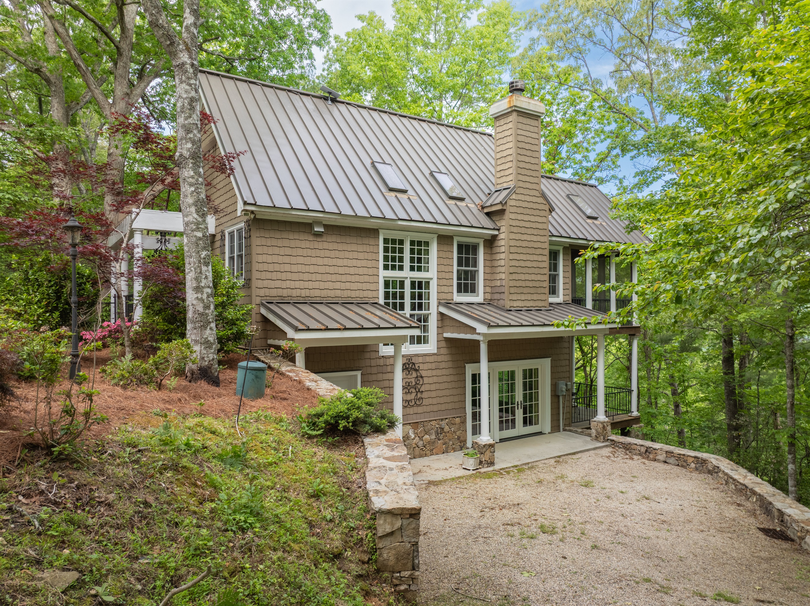 The home offers convenient parking areas with easy access to the main and lower levels of the property.