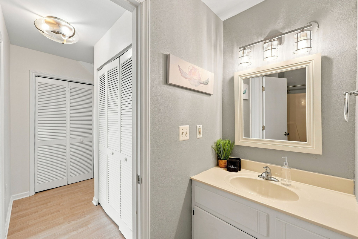 Conveniently located just down the hall with easy access to bedroom closets and living spaces.