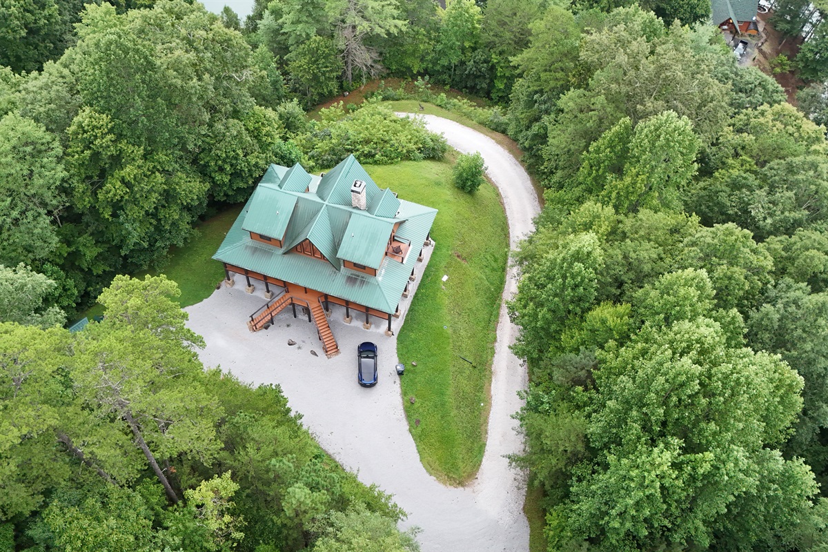 Spacious mountain retreat. This expansive log cabin offers ample space and stunning outdoor living areas.