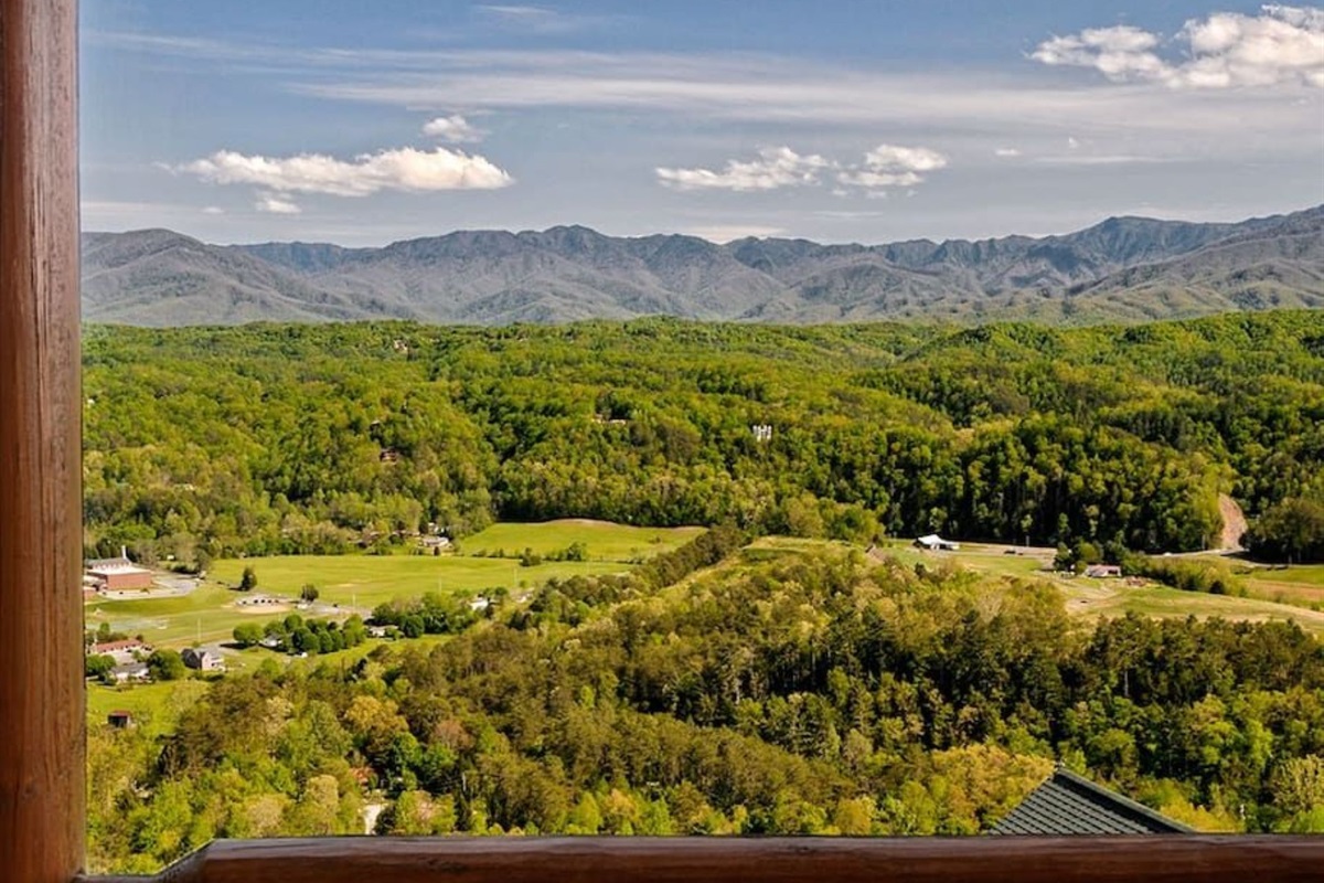 - Expansive mountain view stretching over green valleys and forest tops   - Gaze across rolling hills and the Smoky Mountain horizon in daylight   - Perfect spot for quiet mornings filled with natural beauty and calm
