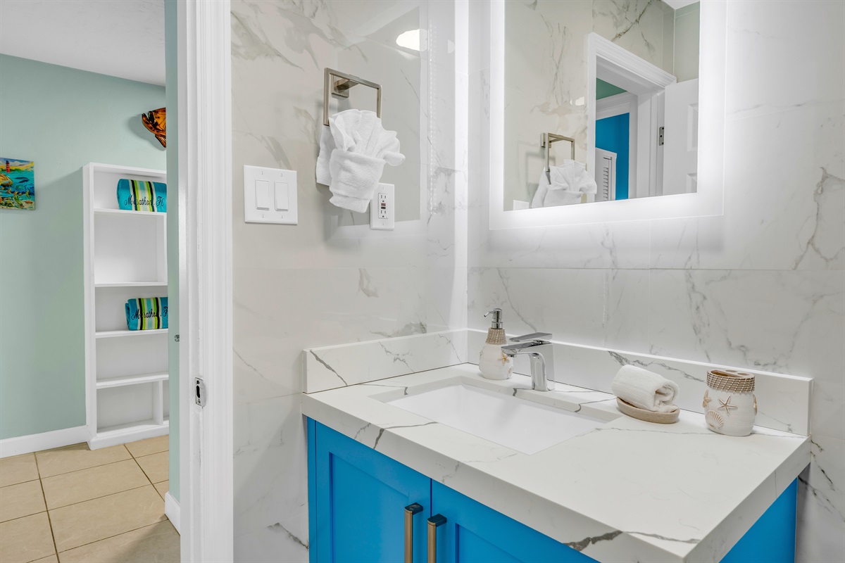 Heading out of the hall bathroom towards the third bedroom.