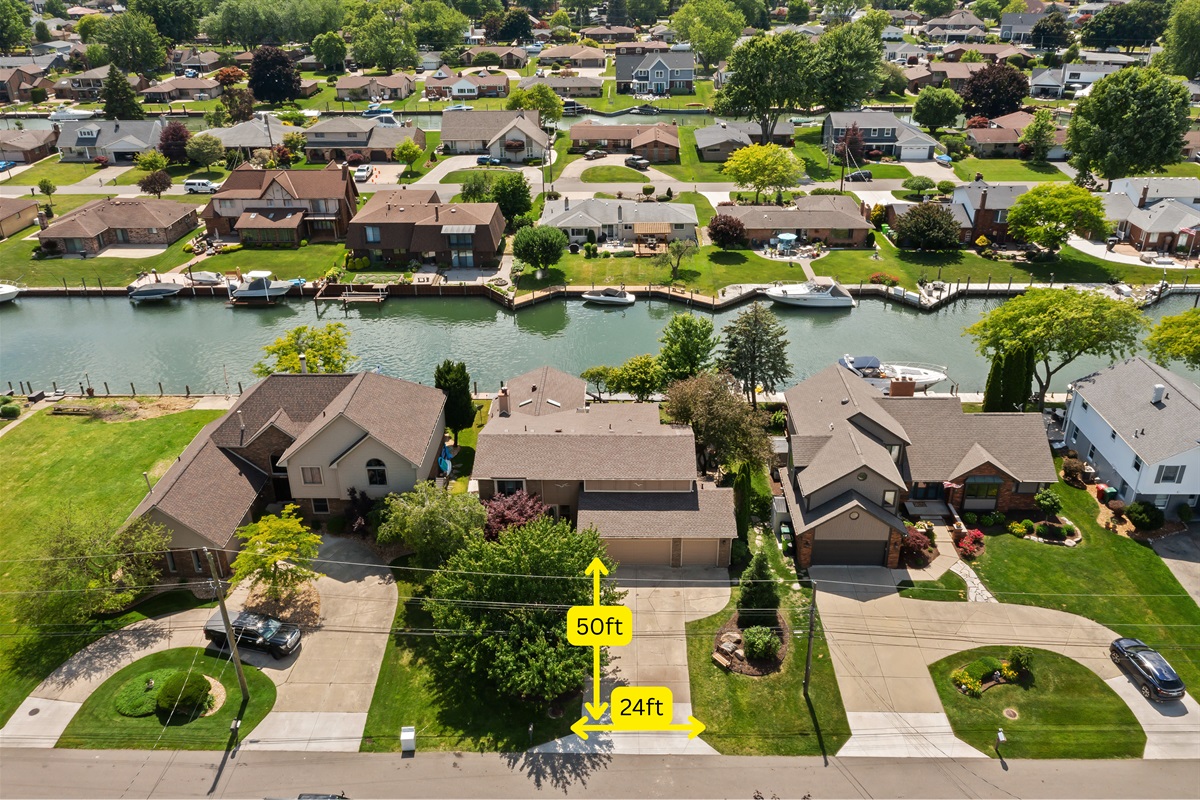 The driveway is 50ft long and 24ft wide and the boat frontage/dock is 75 feet long