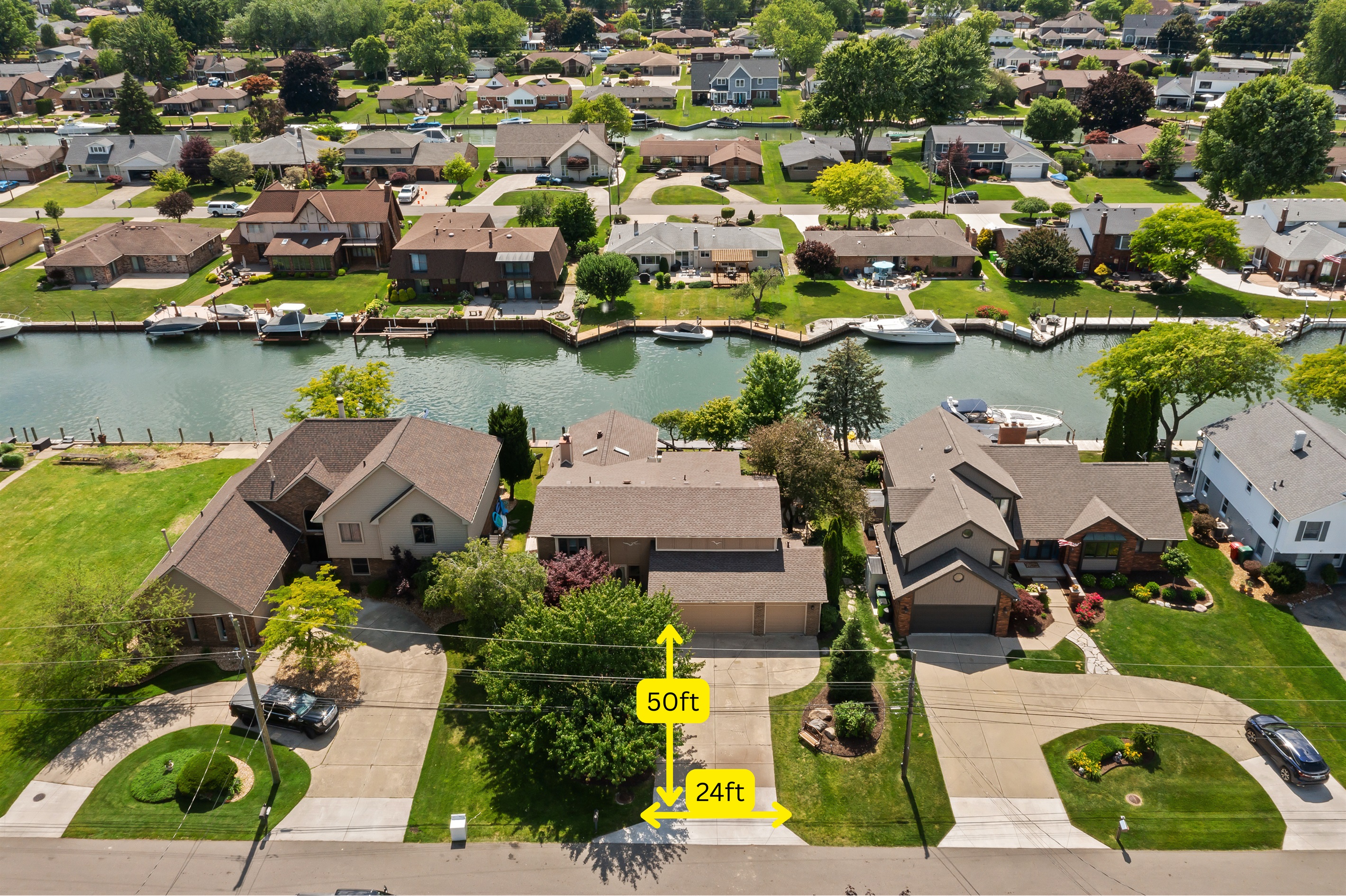 The driveway is 50ft long and 24ft wide and the boat frontage/dock is 75 feet long