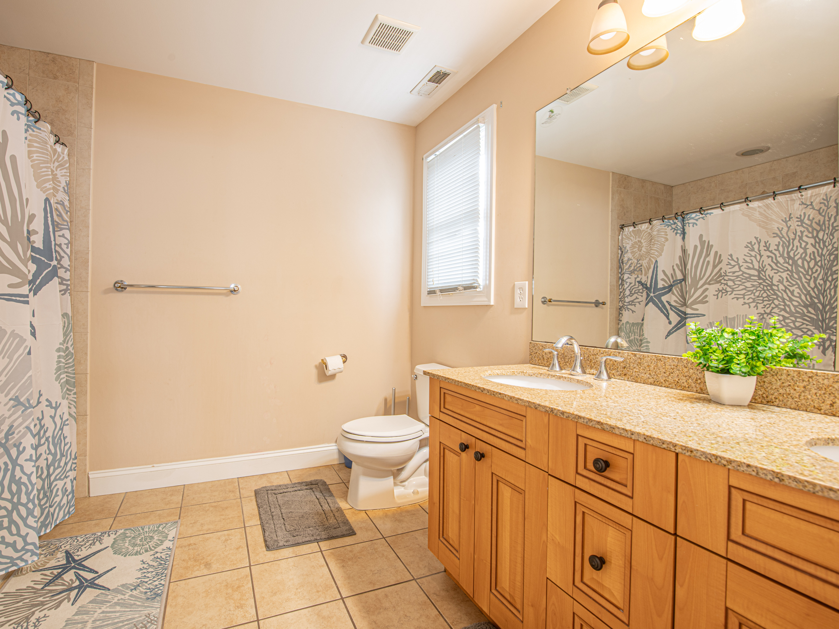Bathroom 5 with Double Vanity and Tile Flooring