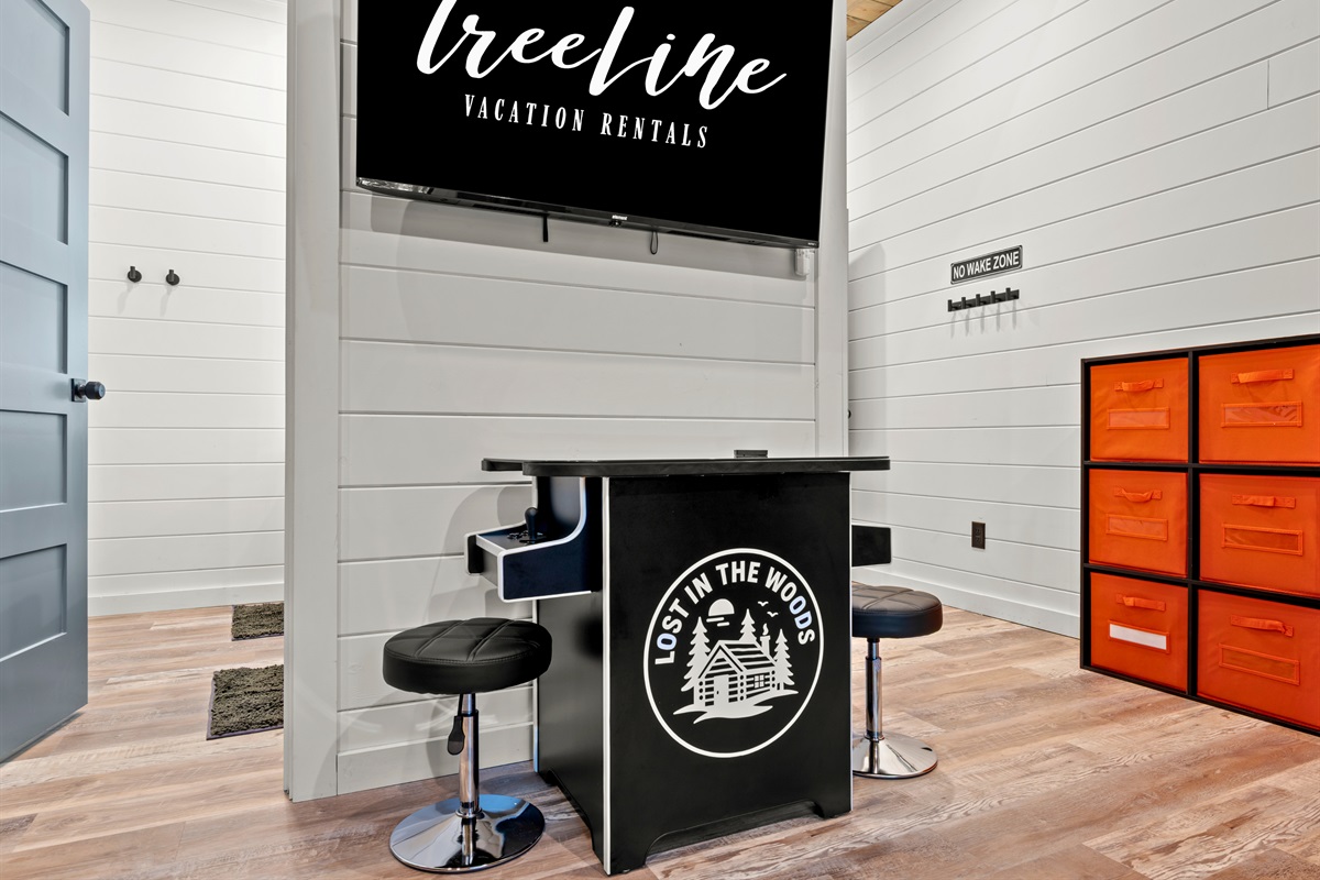 A cozy gaming and lounge corner with a TV provides another spot for entertainment, whether you're watching a movie or playing games.