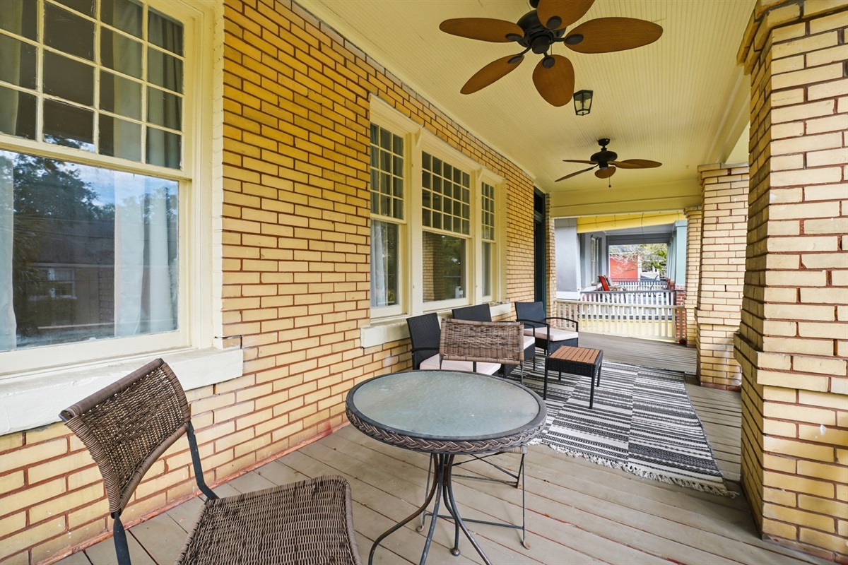Upstairs balcony with many chairs and table to enjoy the view