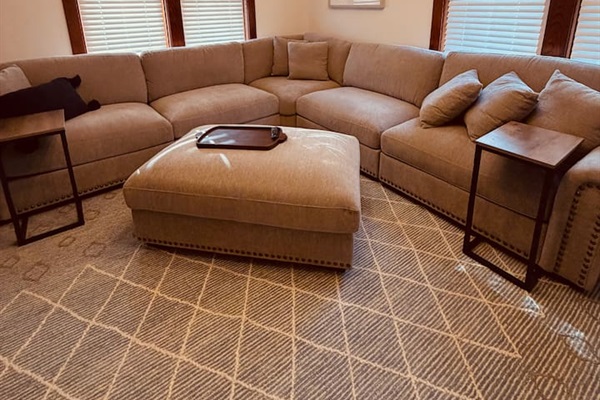 Comfortable living room with smart TV and plenty of seating for your group