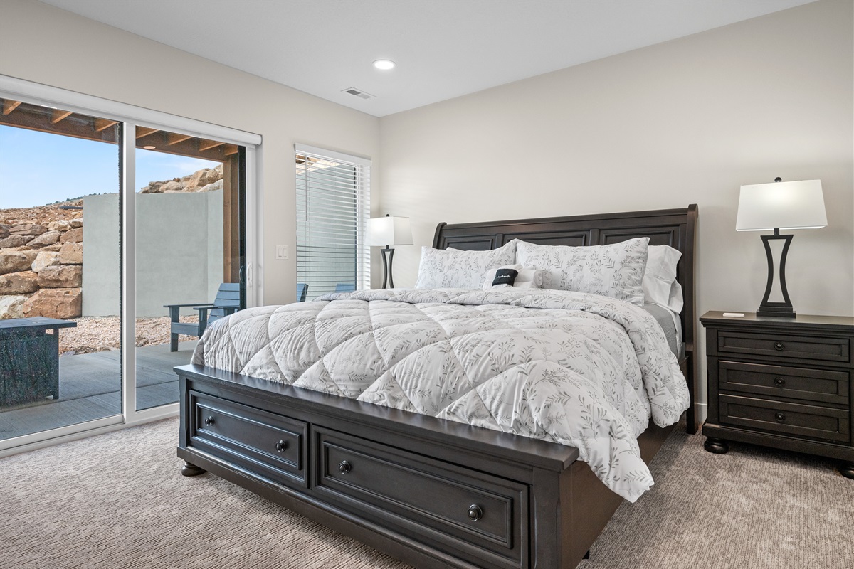 This lower level bedroom has a king bed and access to the patio.
