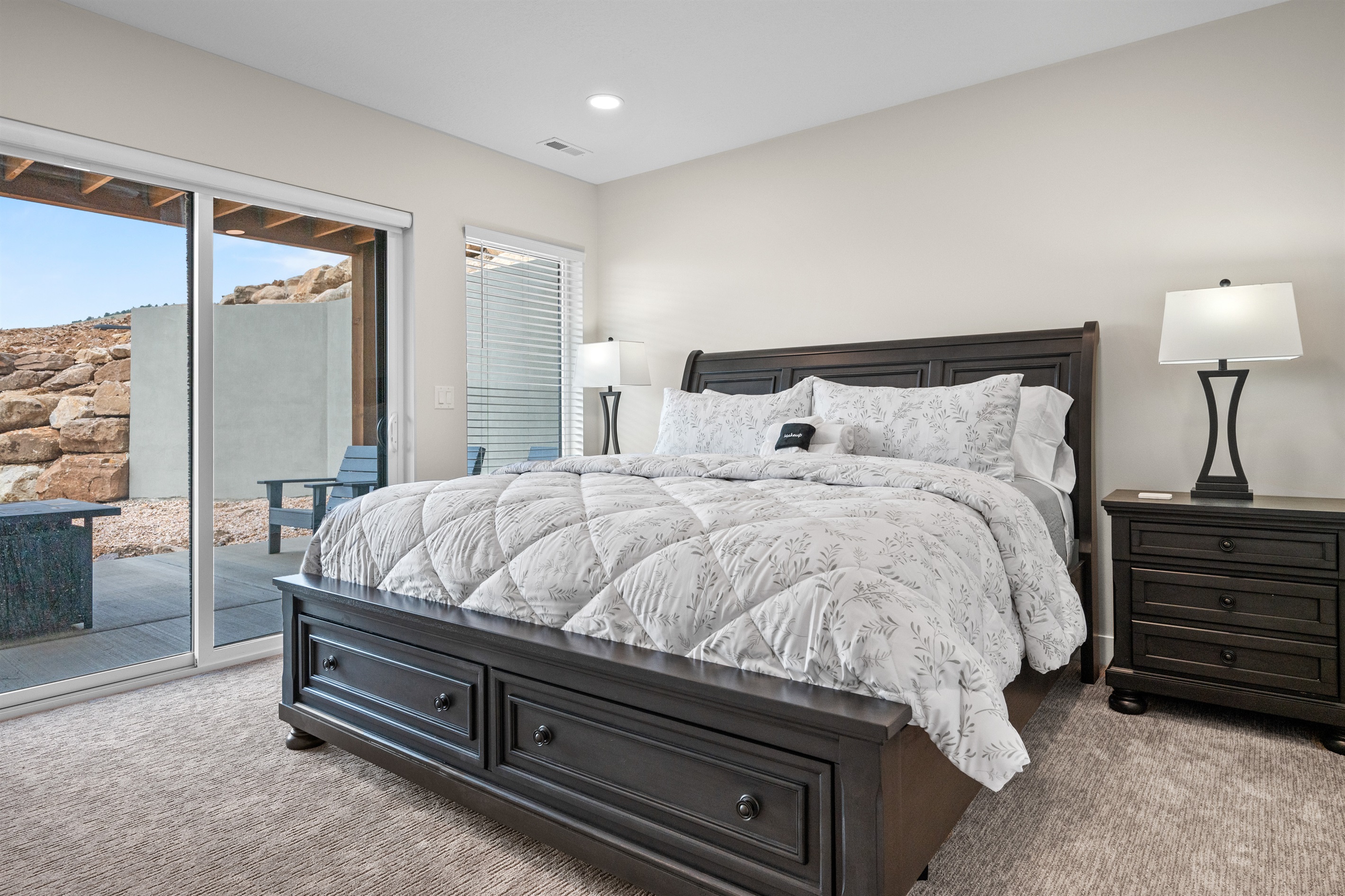 This lower level bedroom has a king bed and access to the patio.