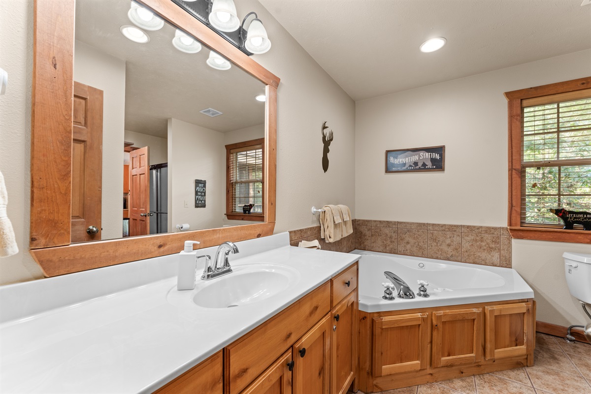 Bathroom with jetted tub and walk in shower