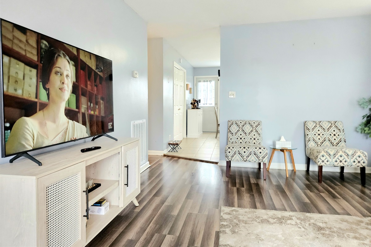 Spacious living room with elegant features and comfortable seating. High Speed WIFI, smart TV and keyless entry included.