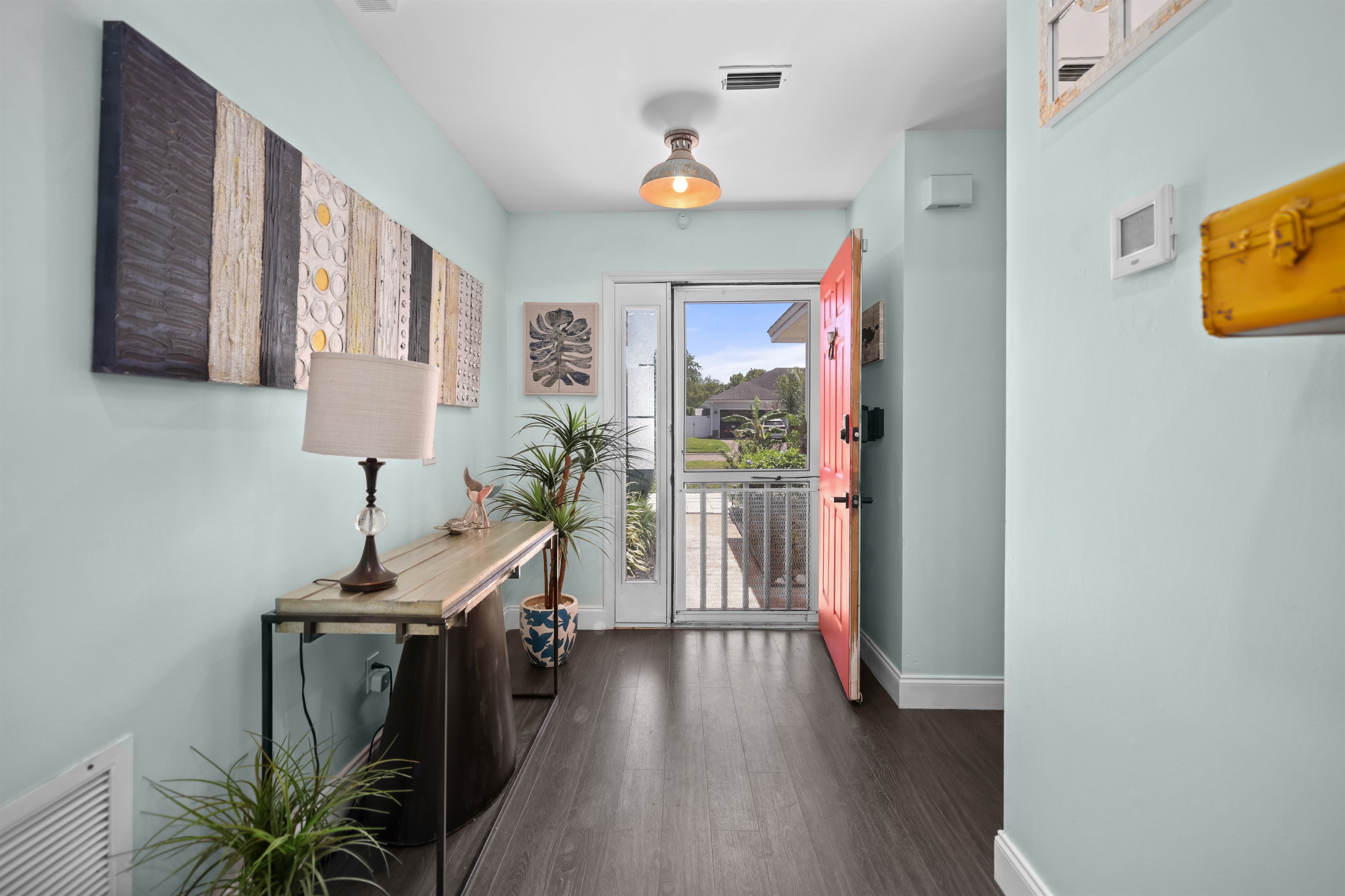 Entryway perspective, showing the interior view looking towards the front door.
