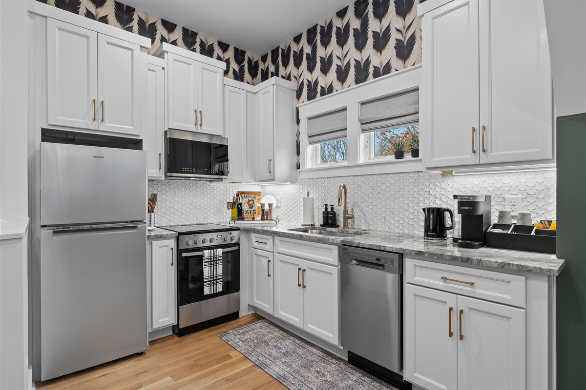 A fully equipped kitchenette with polished finishes for easy meals and morning routines.