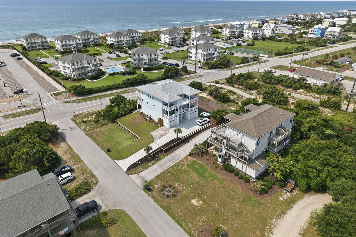 Panoramic aerial view showing the close proximity to the ocean, nearby beach community, and easy access to shoreline activities