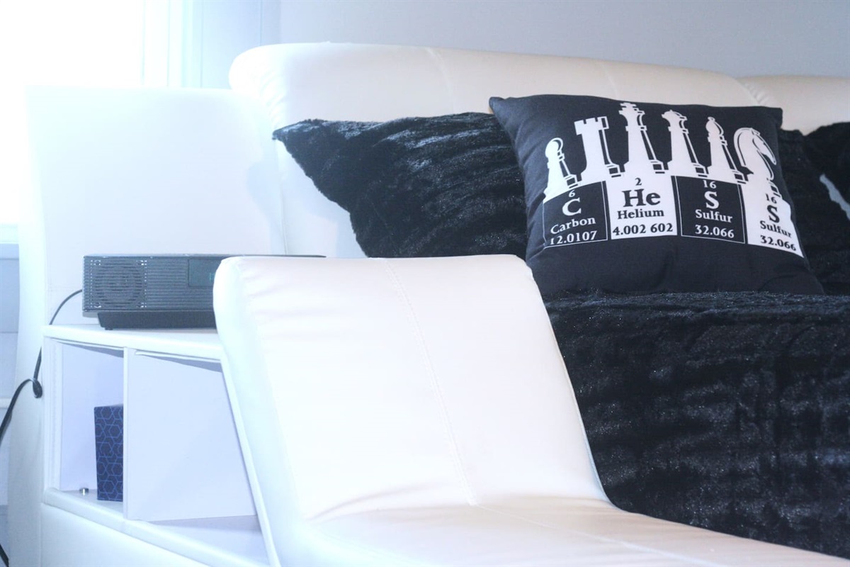 Modern King bed with settee in white.