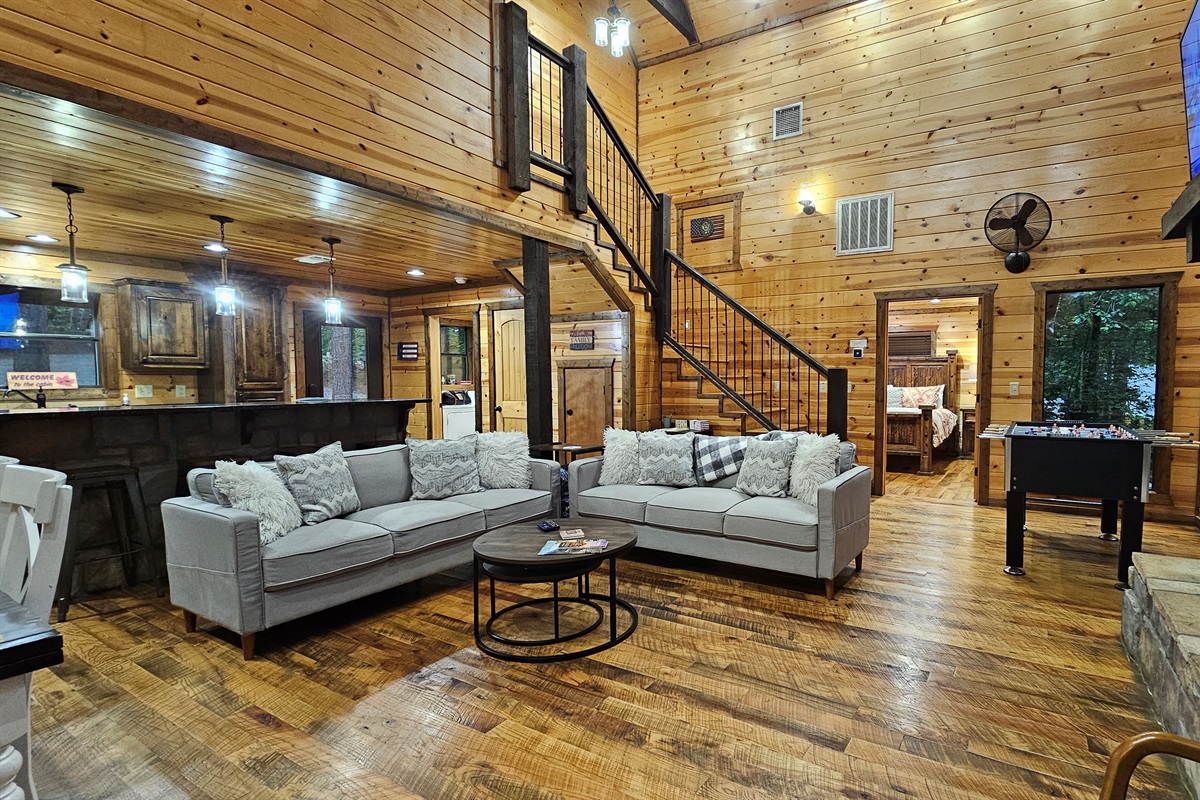Living Room: Expansive space with rustic charm and delightful views, perfect for gathering and relaxing!