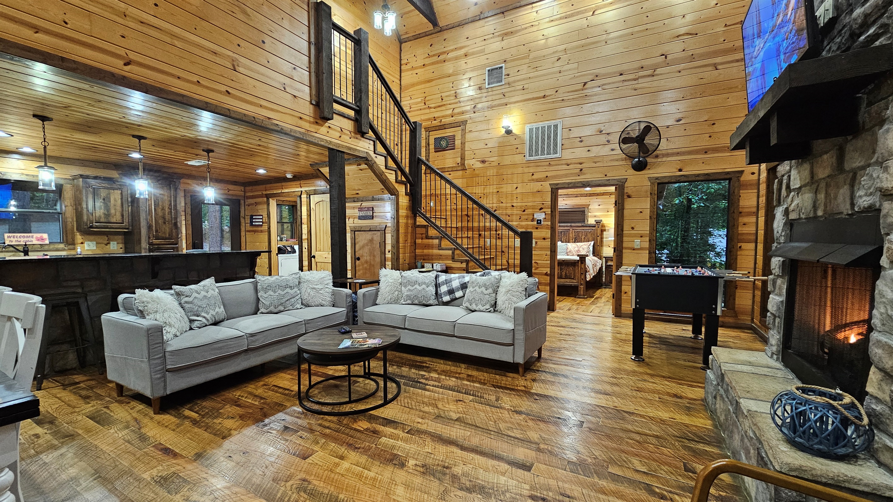 Living Room: Expansive space with rustic charm and delightful views, perfect for gathering and relaxing!