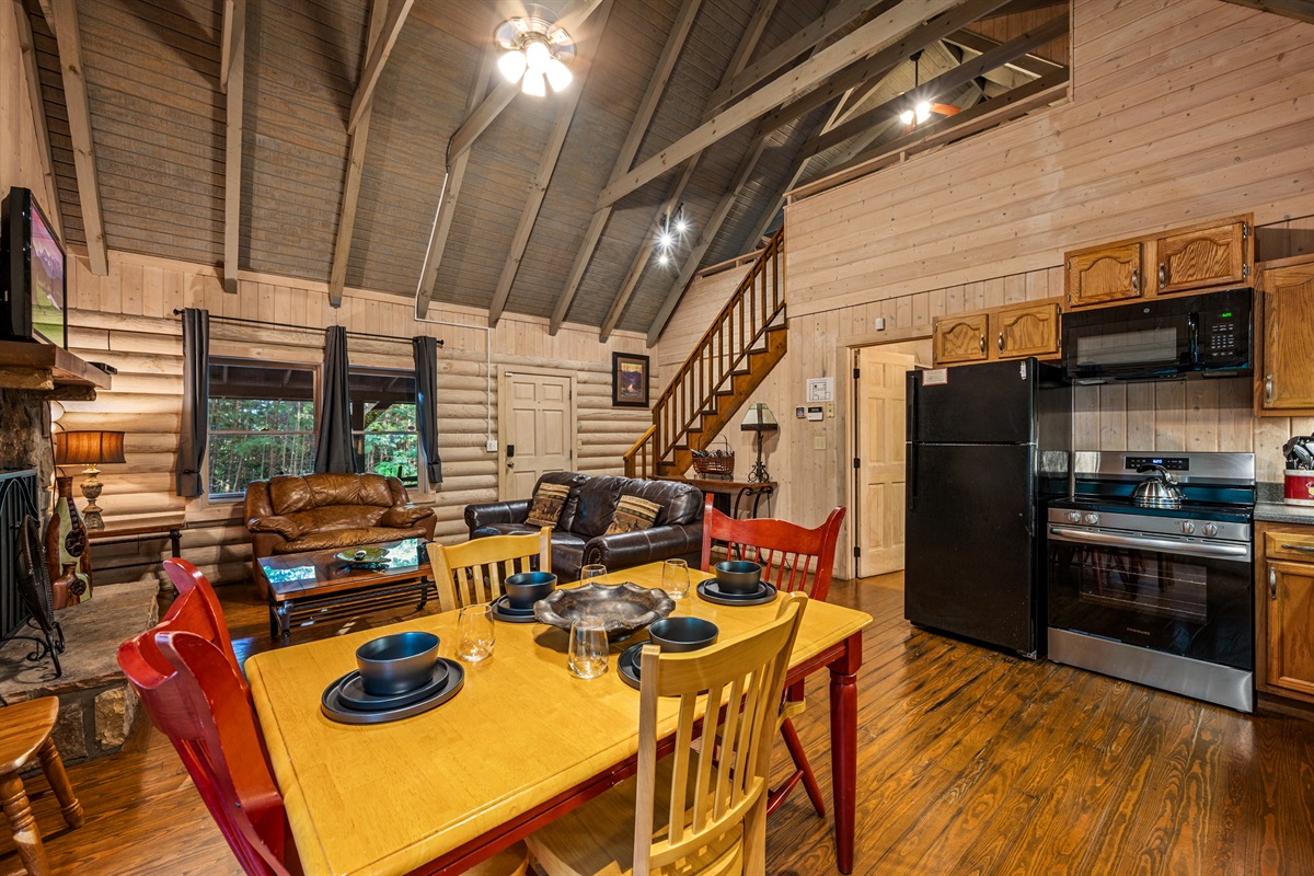 Gather here! Open-concept kitchen, dining, & living with fireplace.
