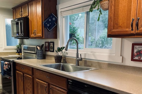 A functional kitchen with clean lines and thoughtful details, perfect for preparing meals and gathering around.