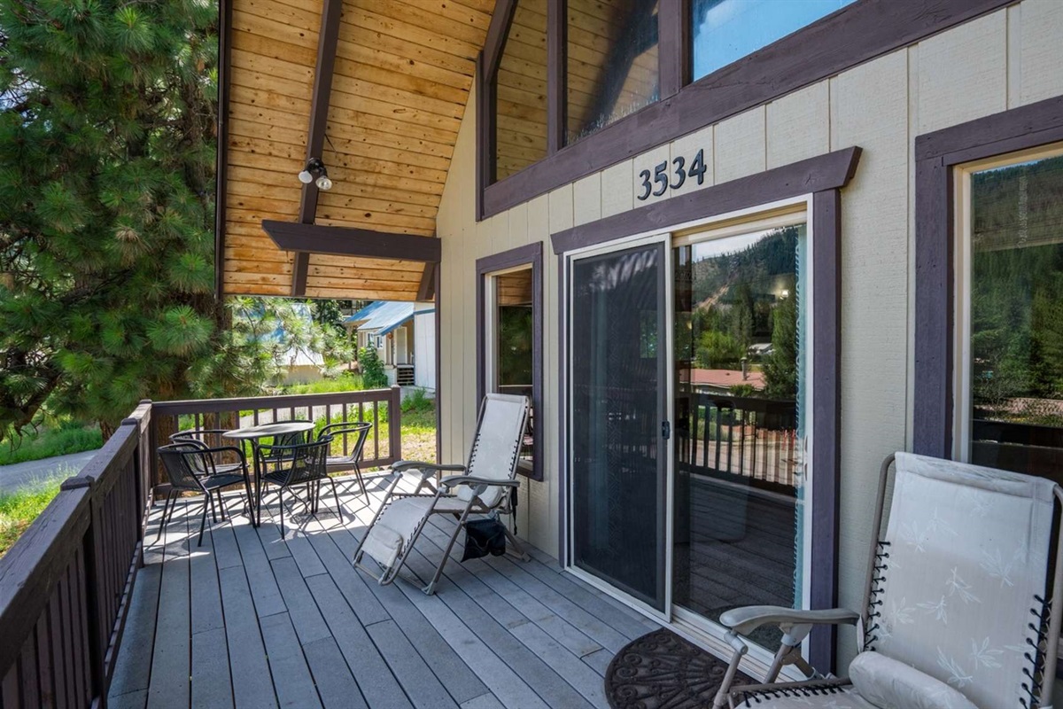 Spacious front deck with seating — perfect for morning coffee or evening wine.