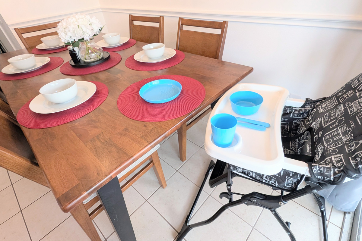 Kid-friendly amenities are provided, including an adjustable high chair and children’s dinnerware.