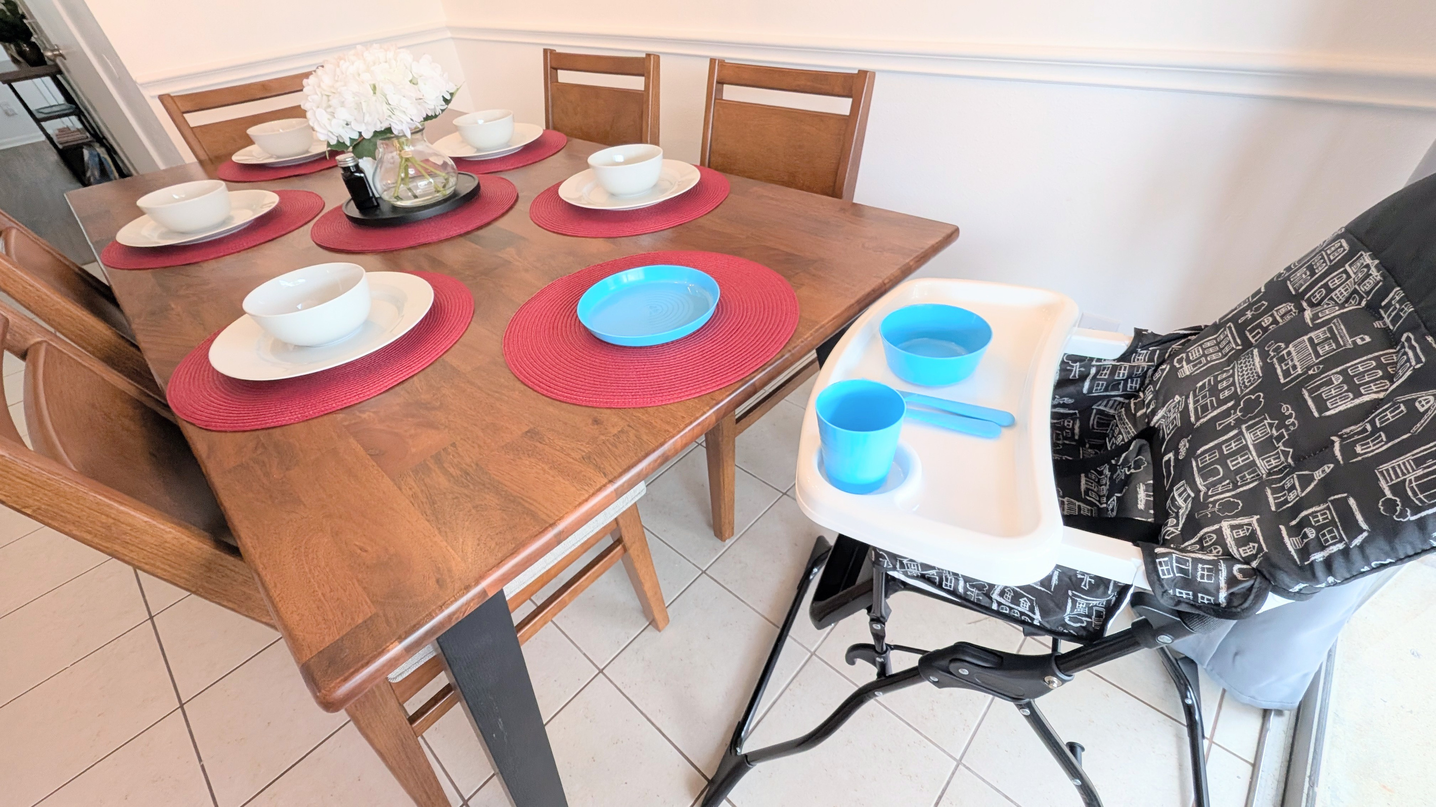 Kid-friendly amenities are provided, including an adjustable high chair and children’s dinnerware.